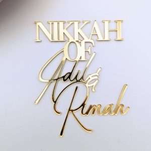 Personalised acrylic nikkah name cake charm in gold.